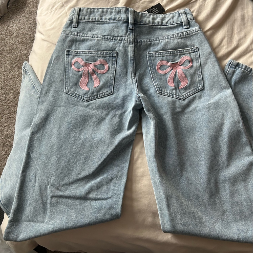 Women's Light Blue Jeans with Pink Bow Accents